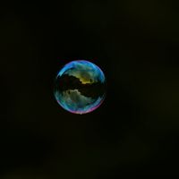 Soft light refractions on a dark surface